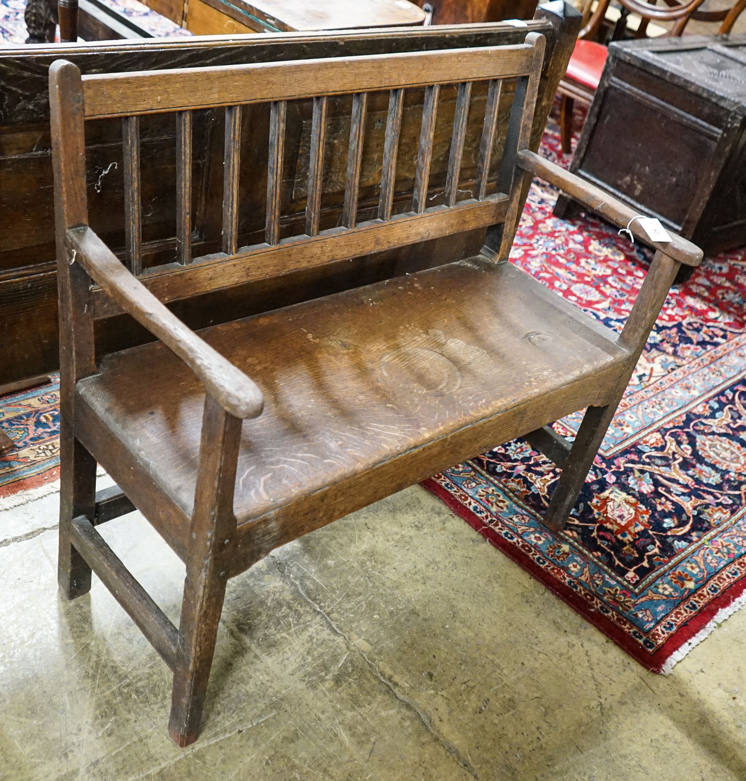 A late 18th century oak chair back settle, width 91cm, depth 38cm, height 85cm